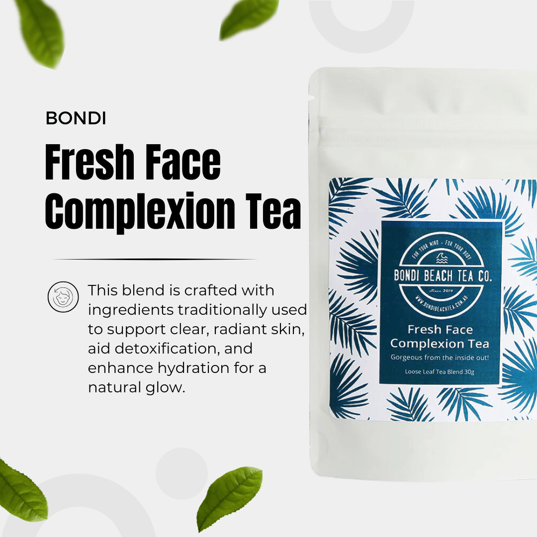 Bondi Beach Tea Cos Fresh Face Complexion Tea pouch, enhancing skin health by supporting acne, detoxification, and hydration, is displayed with packaging featuring green palm leaves and scattered decorative leaves around.