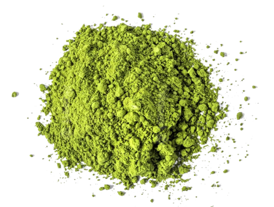Organic Japanese Matcha Latte powder from Bondi Beach Tea Co is scattered across a white background. The vibrant green and fine, textured appearance with some small clumps hints at its premium quality and renowned health benefits.