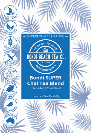 Product label for Bondi Beach Tea Co Organic SUPER Chai Tea 💪🏋️, infused with turmeric and hemp seed, features icons for vegan, organic, gluten-free, no added flavors/sugar, cruelty-free, all-natural, Australian-made; blue tropical leaf background.