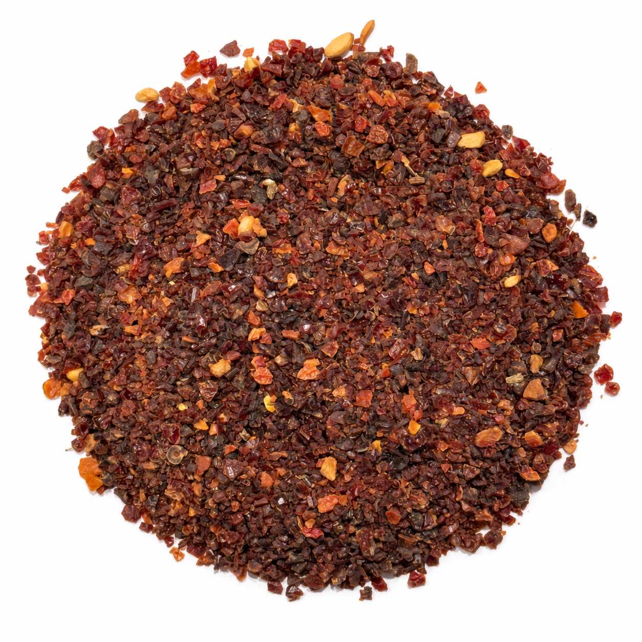 Dried rosehip granules on a white background
